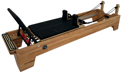 Wooden Pilates reformer machine on a white background
